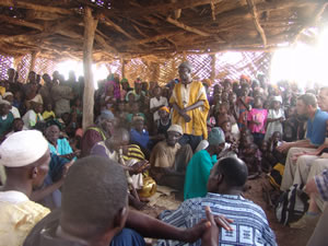 Chief Zakaria , his elders and people welcome Simon's friends to their village in 2006