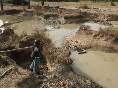 digging mud bricks near Pougyango, Burkina Faso